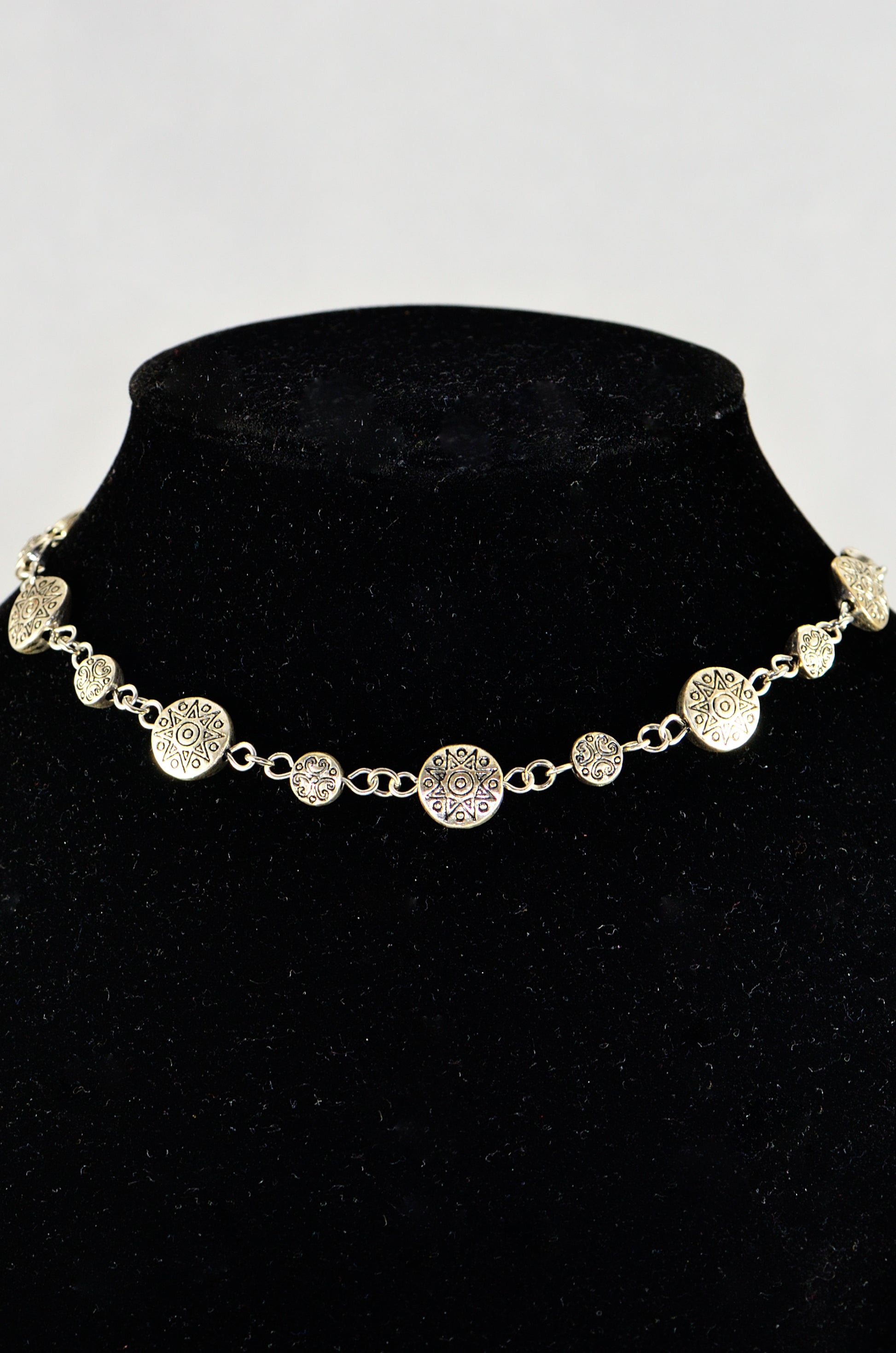 Close up of Tibetan Silver Star Sun and Moon Choker Necklace.
