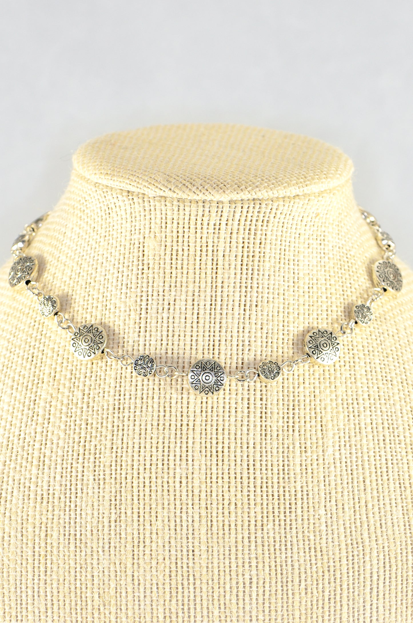 Close up of Tibetan Silver Star Sun and Moon Choker Necklace.