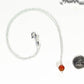 Dainty Carnelian Choker Necklace beside a dime