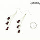Long Silver Plated Chain and Garnet Crystal Chip Earrings beside a dime