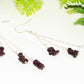 Close up of  Long Silver Plated Chain and Garnet Crystal Chip Earrings