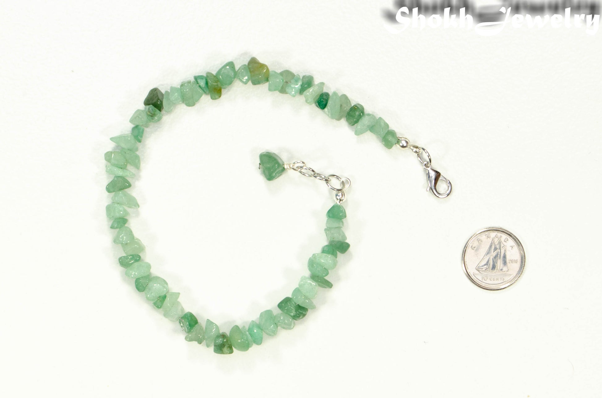 Natural Green Aventurine Crystal Chip Anklet beside a dime.